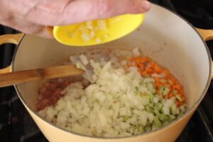 Diced vegetables added to pot and stirred