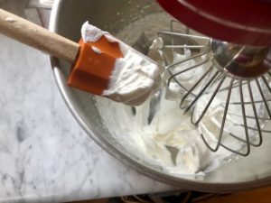 Egg whites mixed to form soft peaks
