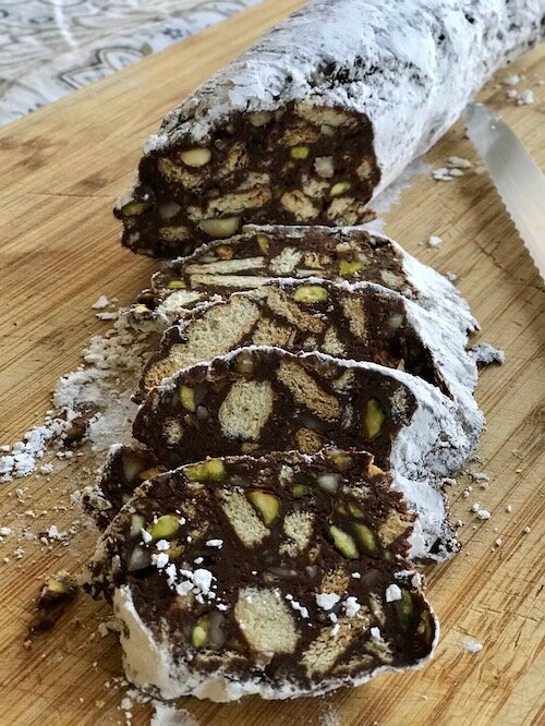A roll of chocolate salami sliced