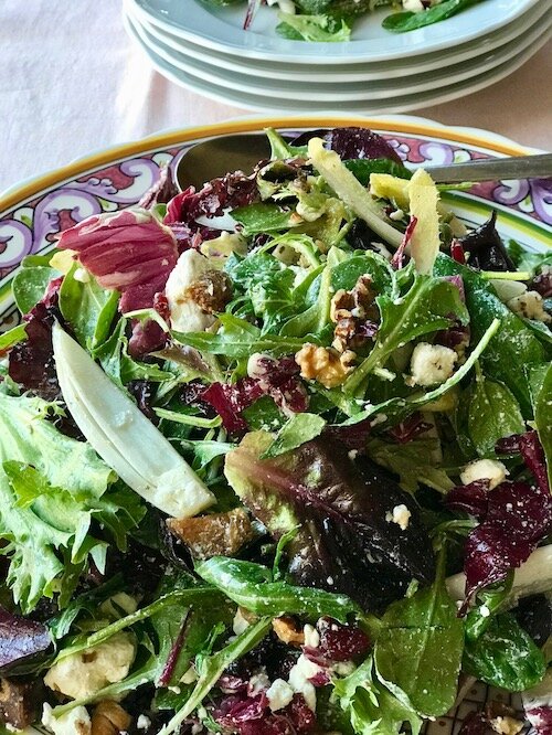 Mixed greens salad with Dried Figs, Cranberries, Walnuts, Goat Cheese with Citrus Vinaigrette
