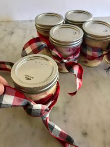 jars with bow ties and lids on them