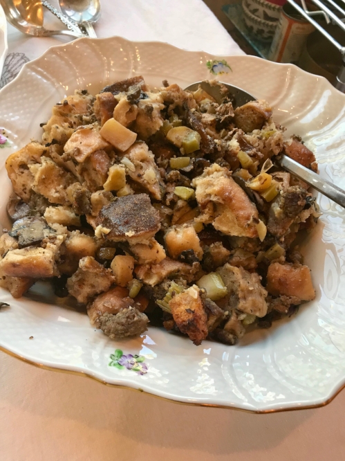 apple, walnut, and sausage stuffing in a serving dish