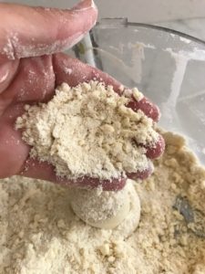food processor with butter and flour in the bowl