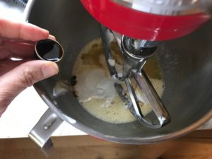 wet ingredients being placed into a stand mixer