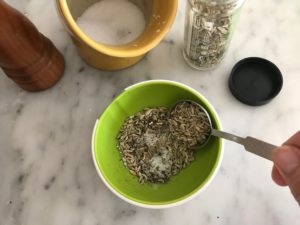 small bowl with salt, pepper, and fennel seeds