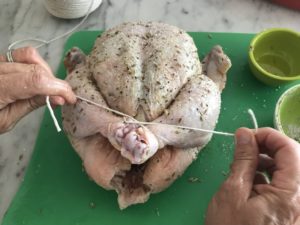 tying the chicken legs together
