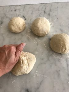 dough separated into 4 pieces