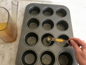 putting oil in the baking tin