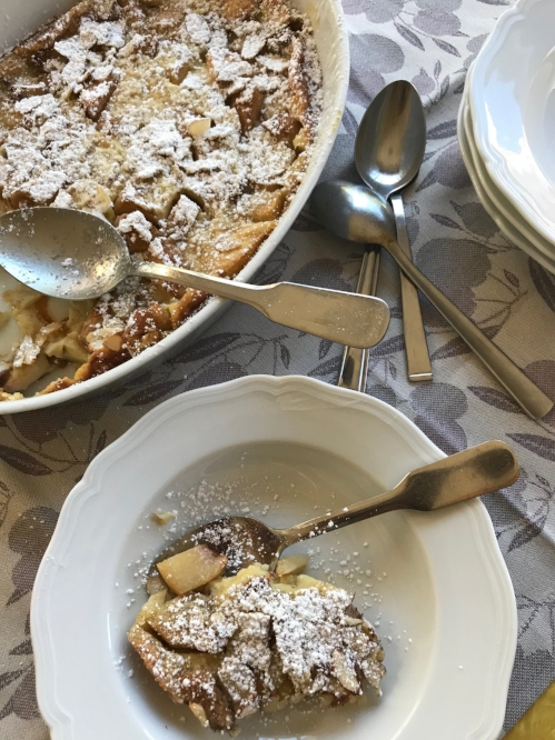 peach clafouti in a serving dish and in a bowl