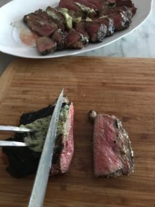 cutting the steak on a cutting board