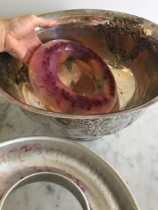 frozen fruit ring into the punch bowl
