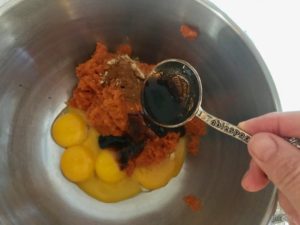 pumpkin, vanilla, egg yolk and spices in a bowl