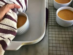 removing ramekins from the baking pan