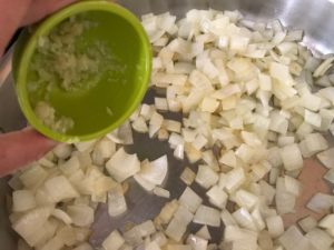saute pan with onions and garlic