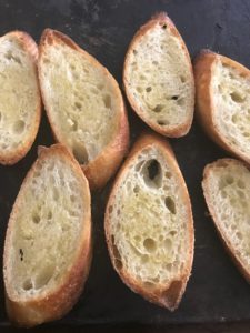 baguette with olive oil brushed on it