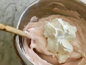 folding the meringue into the semifreddo mixture