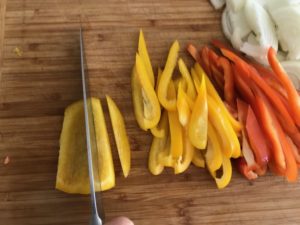 slicing the pepper into strips