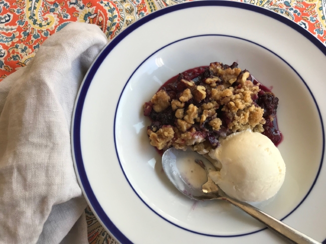 berry crumble served with ice cream