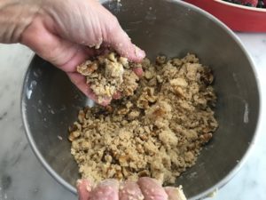 combining all crumble ingredients by hand