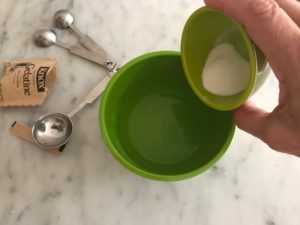 adding gelatin to the water in a small bowl