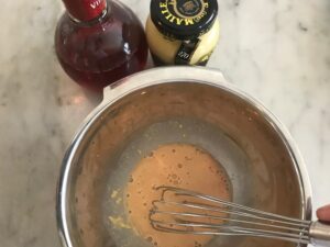 dijon and vinegar mixture in a bowl