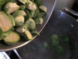 adding the sprouts to boiling water