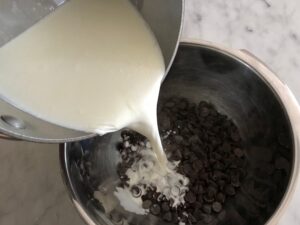 pouring the hot cream over the chocolate