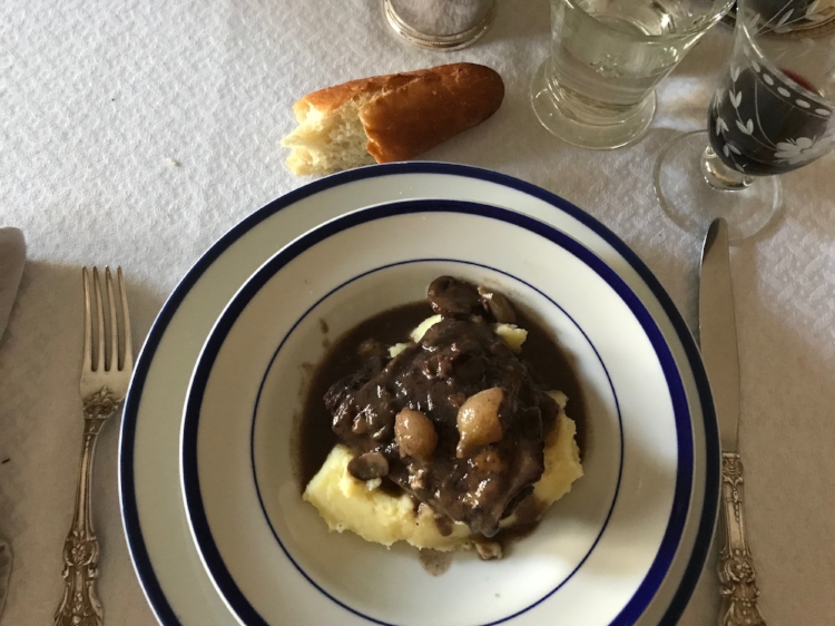 coq au vin with mashed potatoes plated