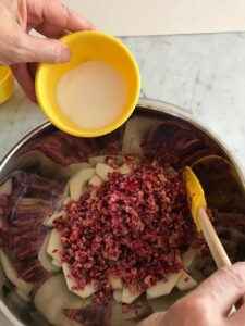 adding sugar to the cranberry pear mixture