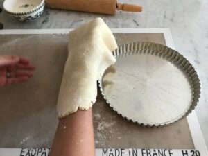 transferring the dough to the tart pan