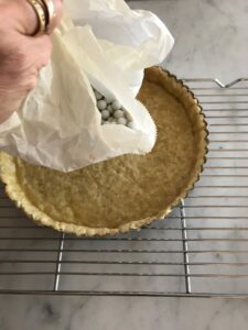 removing the pie weights and parchment