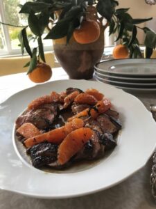 duck breasts with honey and orange on a serving plate