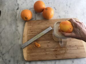 zesting the oranges