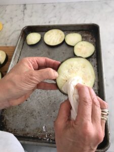 wiping the salt and moisture off the eggplant