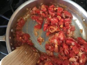 tomatoes and onions in a saute pan