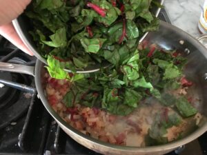 adding the chard leaves
