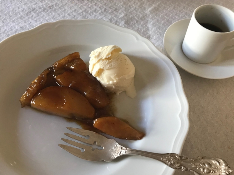pear tarte tatin with ice cream on a plate