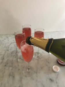 pouring sparkling wine into a champagne flute