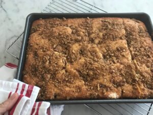 browned crumble cake coming out of the oven