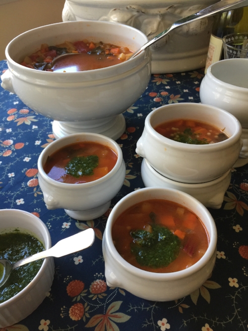 winter vegetable soup with pistou in serving dishes